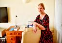 Booker Prize-winning author Dame Hilary Mantel with the desk she is selling in aid of Budleigh Literary Festival.