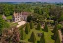 Athlehamton House & Gardens with its 12 yew tree pyramids