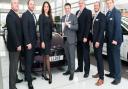 Mark Powell, Head of Business at Lloyd BMW Blackpool, pictured with the BMW Retailer of the Year award, alongside staff.