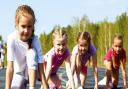 Four pre-teen girls starting to run on track