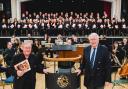 The choral society with John Naylor, music director (left) and John Lea, President of NCS. Photo: Malcolm Hart