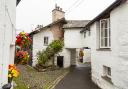 Whitewashed homes along Hawkshead's higgledy-piggledy lanes. Photo: Getty Images