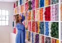 The colourful wall of wool. Photo: Chloe Upton Studio