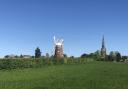 Thaxted Windmill with the church in the background Credit: The Trustees of Thaxted Windmill