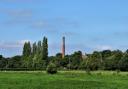 The red brick chimney of Coldharbour Mill commands the view