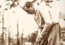 Sir Thomas Henry Cotton, English professional golfer who won three Open Championships, seen here on a golf course checking his clubs and putters, circa 1930s.