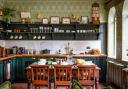 Open shelving in the kitchen shows of some of Antony's finds.