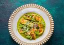 Gnocchi, served on a creamy herby pea sauce, a hazelnut pesto and garnished with pea shoots and the 'cheese with no name'