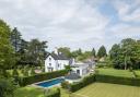 The property comes with stunning gardens, a pool and tennis courts