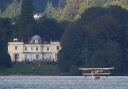 A replica of Waterbird during its first public flight on Lake Windermere in Cumbria.