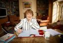 Pam Ayres at her desk