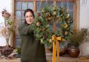 Katie Priestly of the Dorset Flower Company with one of her festive wreaths,