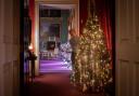 Decorating the tree in the Ante Room at Stourhead. Photo: National Trust, Steven  Haywood