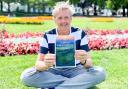 Mark Cummings with his new book in Imperial Gardens, Cheltenham