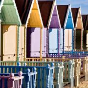 THE NEW BEACH HUTS AT WEST MERSEA, ESSEX, ALL PAINTED IN PASTEL COLOURS