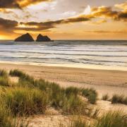 Sunset over Holywell Bay Beach