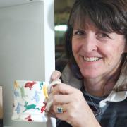 Holt, Norfolk. Emma Bridgwater with some of the Go-Go Hares mugs which are on sale in Break Charity Shop in Holt. 

Picture: MARK BULLIMORE PHOTOGRAPHY