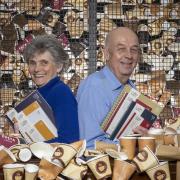 Sarah and Mark Downey, founders of Dorset-based business Epic Print, holding some of their Coffeenotes range of stationery created from recycled paper coffee cups