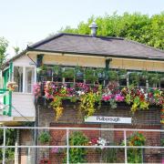 Pulborough's floral train station. Alamy