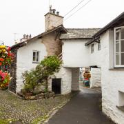 Whitewashed homes along Hawkshead's higgledy-piggledy lanes. Photo: Getty Images