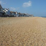 Plenty of space for sunbathing on Deal beach - just bring a firm mat to lie on if you don't want those pebbles digging into your back