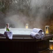 The outdoor hot tub is perfect for couples enjoying a romantic escape