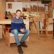 Gareth in his studio in Droylsden. The Neighbourhood cabinets he will exhibit in London are on his workbench and mounted on the wall behind him.