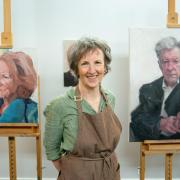 Wendy with her portraits of Joan Bakewell and husband and muse Fred