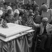 Wilbert Awdry cuts a birthday cake for Thomas the Tank Engine at the National Railway Museum, York in 1980.