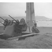 A photograph taken by Olin Dows of an anti-aircraft gun on Plymouth Hoe