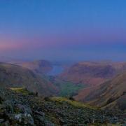 Sunrise while the full moon still sits high above Wasdale. View from Great Gable