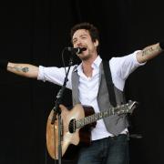 Frank Turner performing on the Main Stage at the Reading Festival.