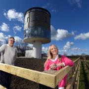 Angela and Chris Hudson outside Flockton water tower near Huddersfield, which they have converted into a home for holiday lets.