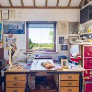 Raymond’s desk, looking across the Sussex Weald towards Ashdown Forest, where he produced all his best-loved books