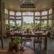 The restaurant at The Pig on the Beach with its terracotta pots of herbs and sea views.