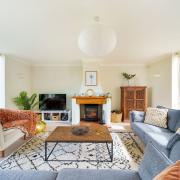 Spacious sitting room with woodburner at Byre House. ( Photo: dorset Hideaways)