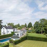 The property comes with stunning gardens, a pool and tennis courts