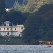 A replica of Waterbird during its first public flight on Lake Windermere in Cumbria.