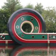 The looping boat bears the name 'The Industry', after the first vessel to navigate the Sheffield & Tinsley Canal when it opened in 1819, and it features the Tudor Rose (the assay mark of Sheffield).