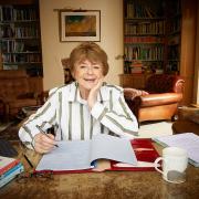 Pam Ayres at her desk