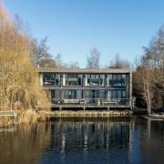 Front Exterior: the front sits out over the lake and there is also lake water close to the rear where the extension was built