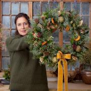 Katie Priestly of the Dorset Flower Company with one of her festive wreaths,