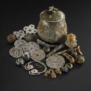 The lidded vessel from the Galloway Hoard and the Viking-age treasures it contained. Image © National Museums Scotland