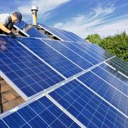 Adding solar panel and efficient insulation to your home, and being smart about your windws can all help reduce energy costs and carbon emisions. PHOTO: Getty