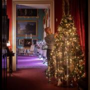 Decorating the tree in the Ante Room at Stourhead. Photo: National Trust, Steven  Haywood