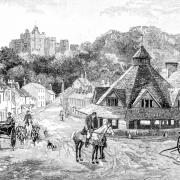 Dunster's Yarn Market with Dunster Castle in the background as illustrated in 1891. Photo: Getty