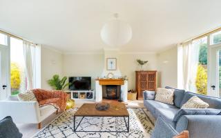 Spacious sitting room with woodburner at Byre House. ( Photo: dorset Hideaways)