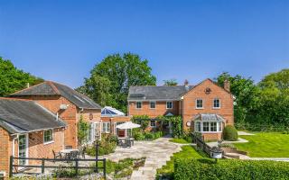 Look at this spacious Hampshire home with an outdoor swimming pool, now on the market