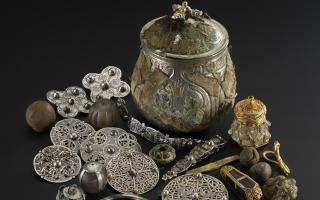 The lidded vessel from the Galloway Hoard and the Viking-age treasures it contained. Image © National Museums Scotland